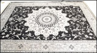 A large Persian floor carpet Abusson rug having a grey ground with geometric borders and central
