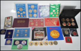 A collection of mostly 20th Century commemorative and mint cons to include coins of Great Britain