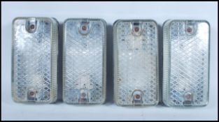 A group of four vintage retro 20th Century industrial prismatic glass bulkhead lights with metal