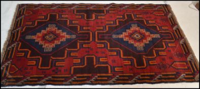 A hand knotted woolen Herati Baluchi carpet floor rug, central panel with traditional motif and