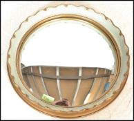 A mid 20th Century Regency revival  circular convex fisheye wall mirror, gilt frame having a
