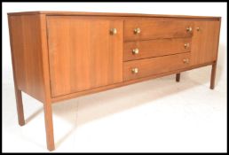 A vintage retro 20th Century teak wood Danish sideboard credenza, flared top over a central bank