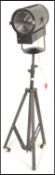 A 20th Century vintage stage /  film / theatre spotlight of tubular form raised on a extendable