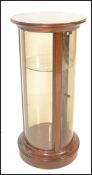A good 20th Century mahogany cylinder bijouterie table / counter top display cabinet, single full
