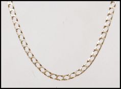 A stamped 9ct gold flat link necklace chain having a lobster clasp. Weight 14.7g. Measures 62cm