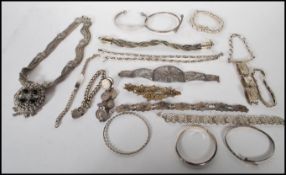 A selection of 20th Century silver and silver white metal bracelets to include a hallmarked silver