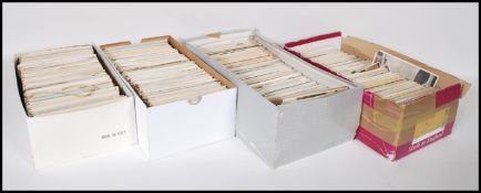 A collection of Vintage British postcards contained within four shoeboxes. Hoard of views from all