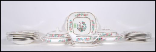 A 20th Century Minton dinner service in the Indian tree pattern having pink floral sprays and