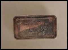 A silver ingot souvenir depicting a 1928 Packard Coupe motor car, marked The National Motor Museum