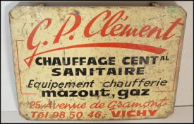 A vintage French 20th Century enameled metal advertising sign with cream ground and red and black