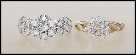 A hallmarked 9ct white diamond cluster ring having flower head illusion setting. Approx 21pts.