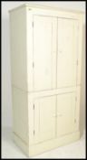 A 20th Century upcycled painted pine scullery / larder upright two piece cupboard. Twin panel