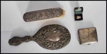 A small group of silver items to include a leather cased silver plated thimble, silver cigarette