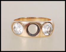 A stamped 18ct gold ring set with two round cut wh