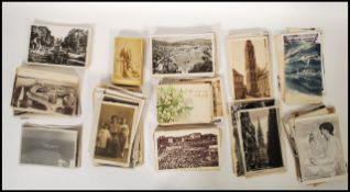 A collection of vintage postcards and photographs dating from the early 20th Century to include