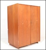 A retro mid 20th Century 1970's teak wood office Industrial cube desk / filing cabinet having twin