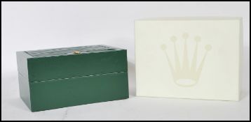 A vintage Rolex watch Geneve Suisse box having a green leather finish with a wave design panel to