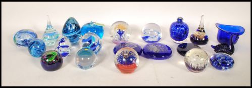 A collection of glass paper weights to include Caithness, Gozo glass, Selkirk, Pembrokeshire, London