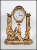 A contemporary Juliana figural pendulum quartz clock, the movement held aloft on classical