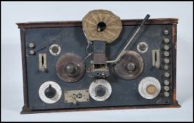 A early 20th Century vintage pine cased Crystal radio receiver having dial and switches to front