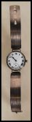 A 1920's/ 30's gentleman's wrist watch having a round face with a white enamelled face with roman