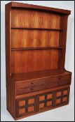 A retro 20th Century Teak wood highboard bookcase cabinet dresser by Nathan with a series of open