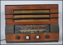 A 1940's vintage Regentone Mullard valve table Radiogram set within a veneered case of rectangular