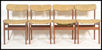 A set of four retro 20th Century Danish inspired teak wood dining chairs in the manner of Kofod