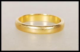 A hallmarked 22ct gold wedding band ring. Hallmarked Birmingham 1960. Weight 3.6g. Size K.5.