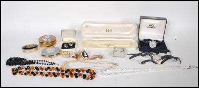 A collection of vintage costume jewellery to include a Tissot Seastar wrist watch with date aperture