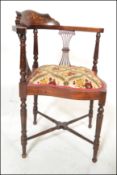 An early 20th Century Edwardian mahogany and marquetry inlaid corner chair / armchair being raised