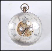 An unusual Roman style fish eyeball clock having a central open skeleton movement with Roman numeral