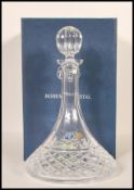 A vintage 20th Century Bohemia cut glass ships decanter having a curved neck and cut glass