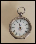 A mid 20th Century continental silver pocket fob watch having engraved floral decoration to the case