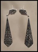 A pair of stamped 925 silver and marcasite Art Deco style drop earrings having textured backs. Gross