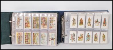 A collection of trade cards and giveaways over two albums to include full sets - Highwaymen issued