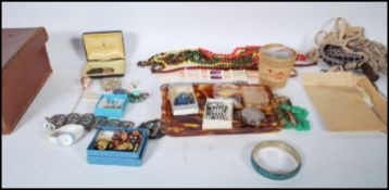 A collection of costume jewellery and other items to include various buttons, earings, belt buckles,