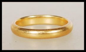 A hallmarked 22ct gold wedding band ring. Hallmarked Birmingham 1934. Weight 4.1g. Size J.