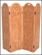 A 20th Century hard wood carved table top discretion folding panel screen, each screen with carved