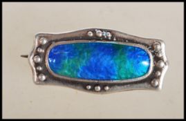 A silver hallmarked Charles Horner early 20th Century arts and crafts brooch having a central