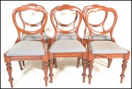 A set of six 19th Century Victorian mahogany balloon back dining chairs, upholstered stuffed seats