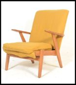 A retro vintage 1960's Parker Knoll 737 elbow armchair. Produced for the French market in the