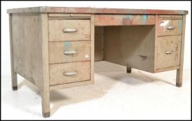 A 20th century metal industrial engineers twin pedestal kneehole desk with a rubber insert / skiver,