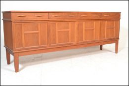 A mid 20th Century retro teak wood sideboard credenza of Danish influence having four short