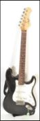 A vintage 20th Century Nevada stratocaster style electric guitar having black paintwork to the