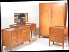 A vintage mid 20th Century bedroom suite consisting of double wardrobe,  matching kneehole