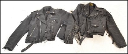 Two leather jackets both having tassels to the arms and backs with one having tassels to the