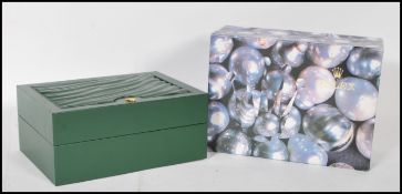 A vintage Rolex watch Geneve Suisse  box having a green leather finish with a wave design panel to