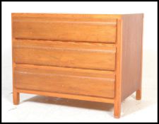 A 20th Century retro Danish light teak wood blind front chest of drawers, three straight drawers