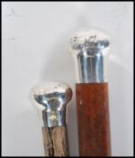 Two early 20th Century silver top walking stick ca